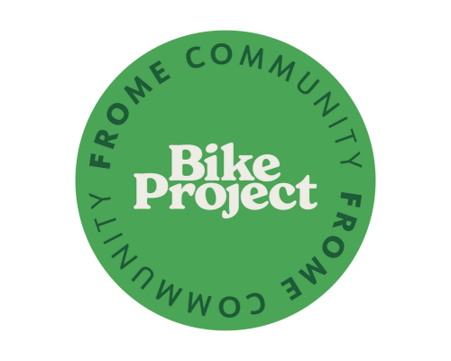 Logo for the Frome Community Bike Project, featuring a light green circle with white and dark green text.